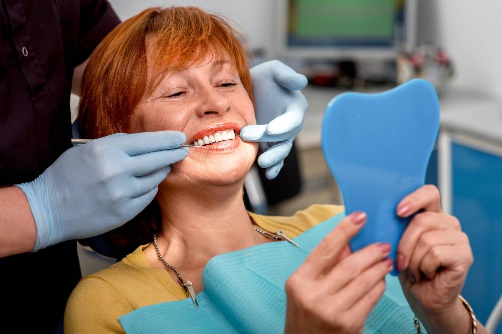 woman smiling in exam chair | wilmington de dentist
