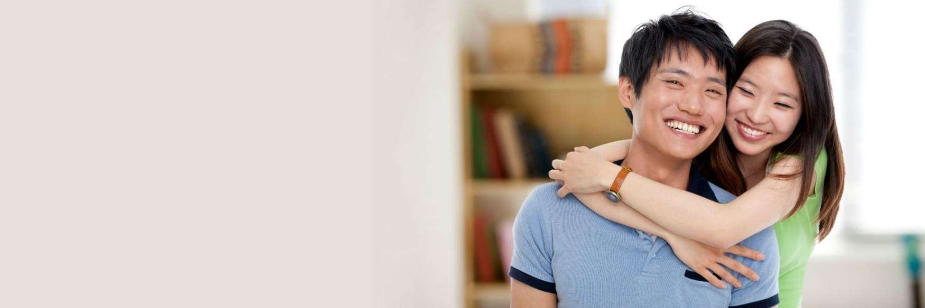 Young asian couple hugging and smiling, Wilmington DE
