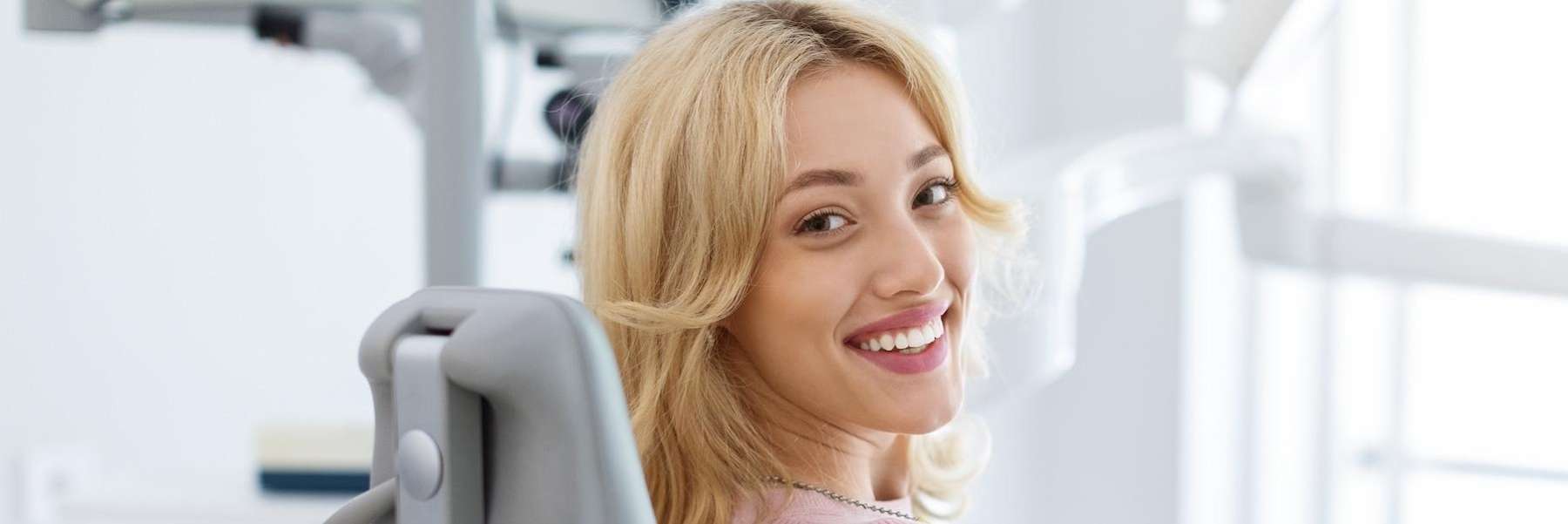 woman smiling in dental chair, wilmington de