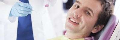 Man in dentist chair getting six month smiles, wilmington de