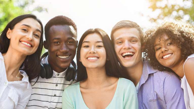 Group of mixed race people smiling, wilmington de