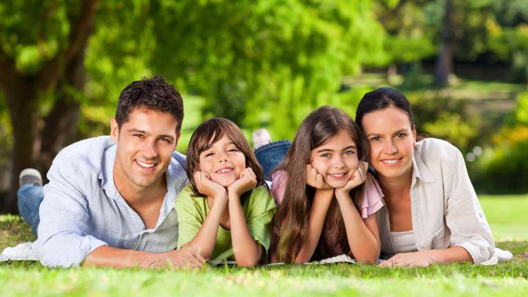 family of four outside | dentist wilmington