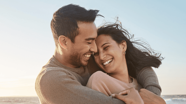 Man embracing women, both smiling in wilmington, de