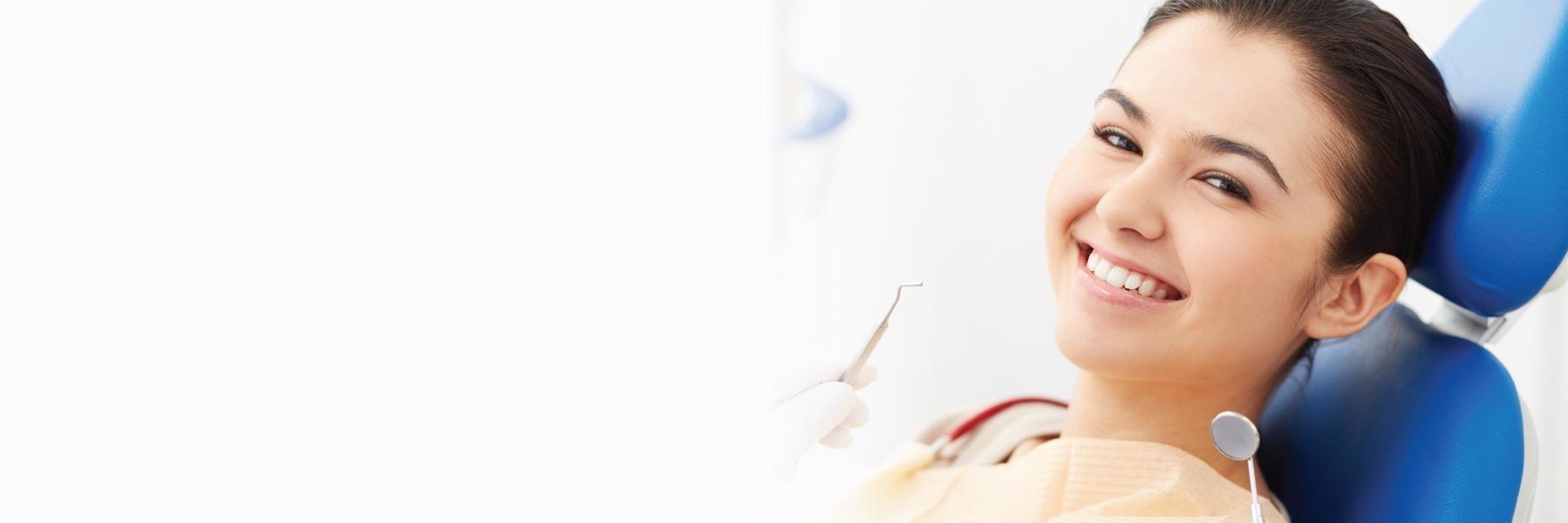 Woman in treatment chair for emergency dental care in Wilmington DE